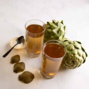 Artichoke Tea (trà atisô) with artichokes, and a small plate of sugar.